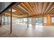 Unfinished basement with exposed ceiling, concrete floor, and sliding doors to the backyard at 7284 Timbercrest Ln, Castle Pines, CO 80108