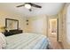 Cozy bedroom with a walk-in closet and an adjoining bathroom at 7284 Timbercrest Ln, Castle Pines, CO 80108