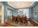 Elegant dining room featuring a chandelier, wood floors, and seating for eight at 7284 Timbercrest Ln, Castle Pines, CO 80108