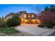 Beautifully landscaped home with large driveway and three car garage at 7284 Timbercrest Ln, Castle Pines, CO 80108