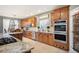 Open kitchen with stainless appliances, granite countertops, and ample storage space at 7284 Timbercrest Ln, Castle Pines, CO 80108