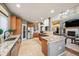 Spacious kitchen with granite countertops, stainless steel appliances, and a large island at 7284 Timbercrest Ln, Castle Pines, CO 80108
