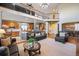 Open-concept living room with high ceilings and seamless flow into the kitchen at 7284 Timbercrest Ln, Castle Pines, CO 80108