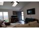 Bright living room featuring vaulted ceilings, and a view of a desk for a great WFH lifestyle at 7988 S Johnson Ct, Littleton, CO 80128