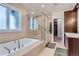 Elegant bathroom with a soaking tub, walk-in shower, and ample counter space at 1237 S Saint Paul St, Denver, CO 80210