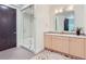 Spa-like bathroom with a large glass shower and modern vanity at 1237 S Saint Paul St, Denver, CO 80210