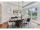 Modern dining room with hardwood floors, large windows, and contemporary decor at 1237 S Saint Paul St, Denver, CO 80210