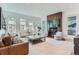 Bright living room featuring a fireplace and access to a deck at 1237 S Saint Paul St, Denver, CO 80210