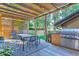 Outdoor patio with pergola, dining area, and built-in grill at 1237 S Saint Paul St, Denver, CO 80210