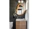 Modern bathroom featuring a unique wood-framed mirror and stylish decor at 12212 W 16Th Dr, Lakewood, CO 80215