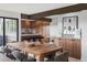 Elegant dining room with a wooden table and view of the kitchen at 12212 W 16Th Dr, Lakewood, CO 80215
