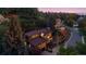 Exterior featuring lush landscaping, mature trees and a multi-car garage at 12212 W 16Th Dr, Lakewood, CO 80215