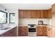 Updated kitchen featuring modern cabinets, stainless steel appliances, and ample countertop space at 12212 W 16Th Dr, Lakewood, CO 80215
