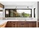 Kitchen area features a large window with a view and modern fixtures at 12212 W 16Th Dr, Lakewood, CO 80215