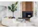 Cozy living room featuring a fireplace, large windows and hardwood floors at 12212 W 16Th Dr, Lakewood, CO 80215