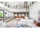 Open-concept living room with vaulted ceilings and modern decor at 12212 W 16Th Dr, Lakewood, CO 80215