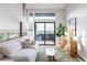 Bright living room with a sliding door to a balcony with beautiful views and modern decor at 12212 W 16Th Dr, Lakewood, CO 80215