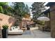Inviting patio with comfortable seating, outdoor dining, and a tranquil garden setting at 12212 W 16Th Dr, Lakewood, CO 80215
