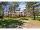 Expansive backyard featuring a deck, providing a perfect outdoor retreat amidst a natural setting at 2880 Lake Meadow Dr, Monument, CO 80132