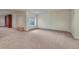 Spacious basement area featuring a large window and carpet floors at 2880 Lake Meadow Dr, Monument, CO 80132
