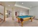 Finished basement featuring a pool table, kitchenette, and carpet floors at 2880 Lake Meadow Dr, Monument, CO 80132
