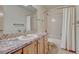 Bathroom featuring a shower/tub combination and vanity with a decorative granite countertop at 2880 Lake Meadow Dr, Monument, CO 80132