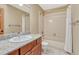 Functional bathroom featuring tiled shower/tub combo and a vanity with granite countertop at 2880 Lake Meadow Dr, Monument, CO 80132