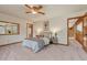 Comfortable bedroom with ceiling fan, neutral color scheme and hardwood floors at 2880 Lake Meadow Dr, Monument, CO 80132