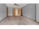 Comfortable bedroom featuring neutral carpeting, cool gray walls, and a ceiling fan at 2880 Lake Meadow Dr, Monument, CO 80132