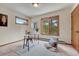 Bright bedroom featuring a work space next to the windows and a comfortable chair at 2880 Lake Meadow Dr, Monument, CO 80132