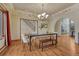 Formal dining room with hardwood floors and an elegant chandelier at 2880 Lake Meadow Dr, Monument, CO 80132