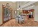 Cozy dining area with access to the patio and a view of the chef's kitchen at 2880 Lake Meadow Dr, Monument, CO 80132