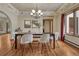 Beautiful dining room with hardwood floors, chandelier, and ample natural light at 2880 Lake Meadow Dr, Monument, CO 80132