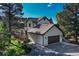Lovely home with a two-car garage and beautiful landscaping at 2880 Lake Meadow Dr, Monument, CO 80132