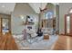Inviting living room with vaulted ceilings, fireplace, and built-in bookshelves at 2880 Lake Meadow Dr, Monument, CO 80132