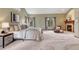 Serene primary bedroom with plush carpet, fireplace, and en-suite bathroom at 2880 Lake Meadow Dr, Monument, CO 80132