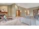 Large main bedroom featuring a cozy fireplace and carpeted floors at 2880 Lake Meadow Dr, Monument, CO 80132