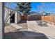 Large backyard with an open garage and outdoor seating area, ideal for entertaining and relaxing at 1765 S Franklin St, Denver, CO 80210