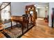 Versatile home office with hardwood floors, tiger rug, ample desk space, and shelving at 1765 S Franklin St, Denver, CO 80210