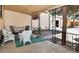 Comfortable covered patio with wrought iron railings and white wicker furniture for relaxing outdoors at 1765 S Franklin St, Denver, CO 80210