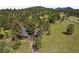 Aerial view showcasing the home nestled among trees, offering privacy and a serene setting at 29663 Paint Brush Dr, Evergreen, CO 80439
