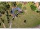 Birds-eye view of the home with a deck and plenty of green space, perfect for entertaining and relaxation at 29663 Paint Brush Dr, Evergreen, CO 80439