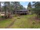 Backyard featuring a treehouse and play area perfect for outdoor fun at 29663 Paint Brush Dr, Evergreen, CO 80439