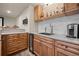 Basement bar area featuring a granite countertop, wine fridge, and beverage tap at 29663 Paint Brush Dr, Evergreen, CO 80439