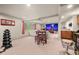 Spacious basement with a projector screen and entertainment area at 29663 Paint Brush Dr, Evergreen, CO 80439