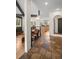 Welcoming entryway featuring stone tile floors, open to the living room, dining room and kitchen at 29663 Paint Brush Dr, Evergreen, CO 80439