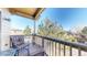 Private balcony with patio furniture and treetop views at 6931 Buckskin Dr, Littleton, CO 80125