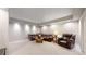 Finished basement Gathering room with plush seating at 6931 Buckskin Dr, Littleton, CO 80125