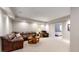 Finished basement with leather sectional sofa and recliner at 6931 Buckskin Dr, Littleton, CO 80125