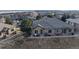 Tan townhome with patio and mountain views in the background at 6931 Buckskin Dr, Littleton, CO 80125